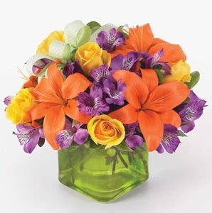 Green cube vase arrangement with orange lily, purple Peruvian lilies, yellow spray roses - Local*Florist