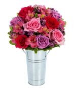 bouquet of red and purple flowers including roses and Peruvian lilies