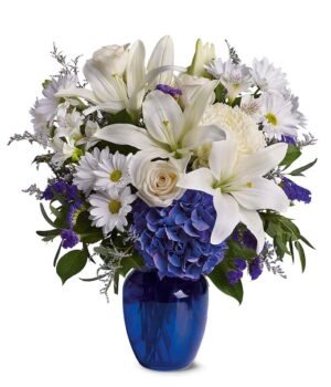 crème roses, white lilies and alstroemeria along with white chrysanthemums, eucalyptus, limonium